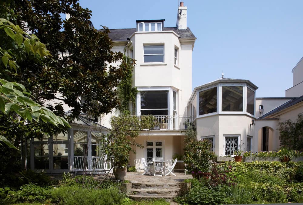 Exterior rear garden view of Grade II listed Crown Estate townhouse at Park Village East, Regent's Park, London