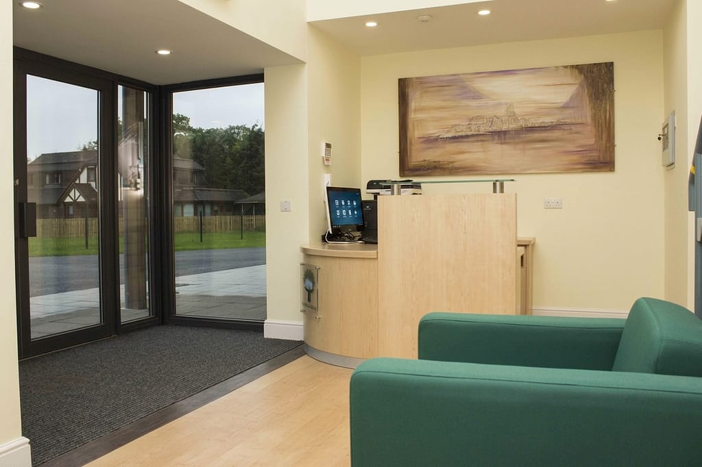 Reception area interior at New Barn School, designed with calming autism-friendly finishes