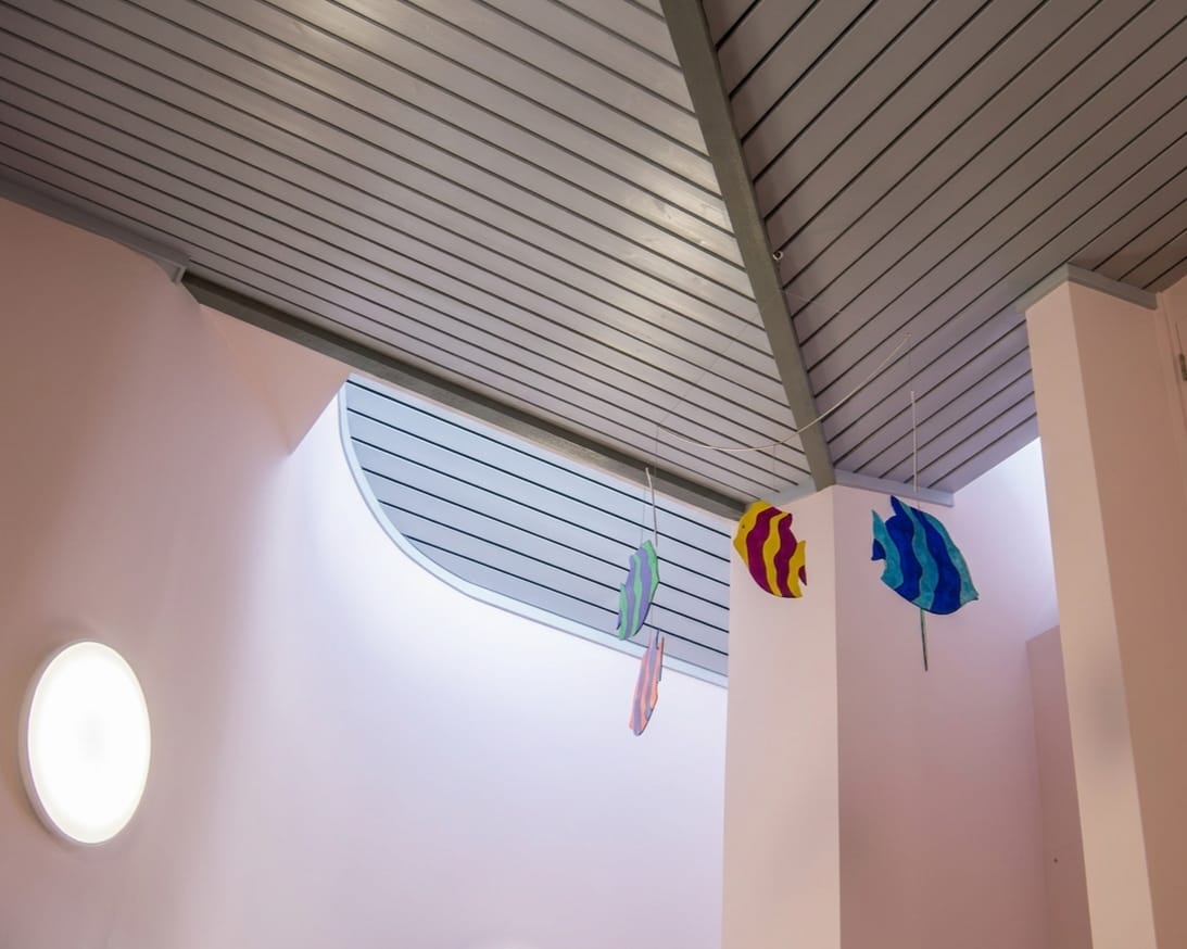 Photograph of acoustic ceiling panels illustrating sound absorption in an autism-friendly space